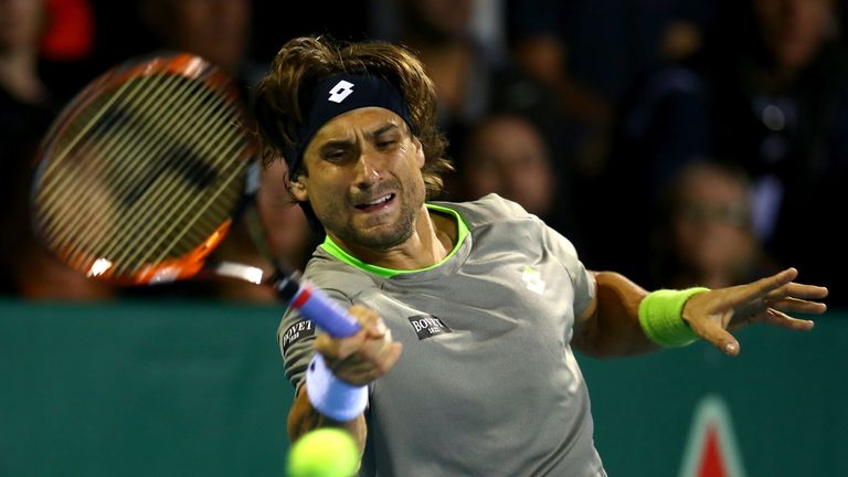David Ferrer plays a forehand during his match against Guillermo Garcia-Lopez at the Heineken Open