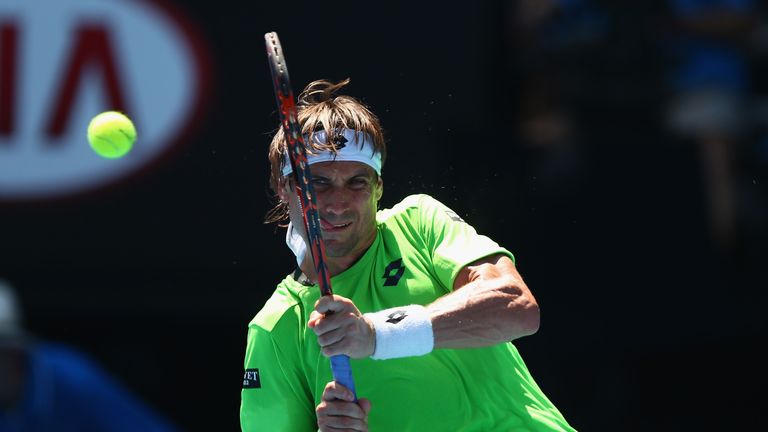 David Ferrer of Spain plays a backhand in his third round match against Jeremy Chardy of France during day five of the Australian Open