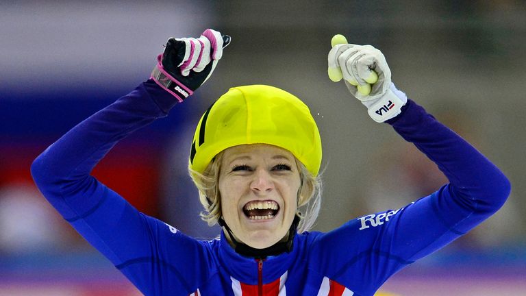 Elise Christie: Celebrates after winning the 1000m in Dresden
