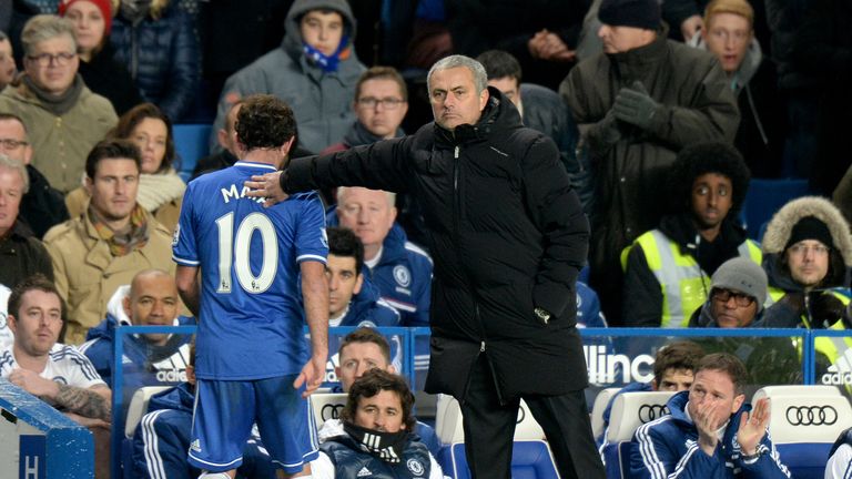 Chelsea manager Jose Mourinho with a pat on the back for Juan Mata after he is substituted  