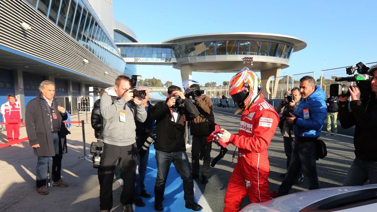 Kimi Raikkonen arrives back at the garage having stopped on track