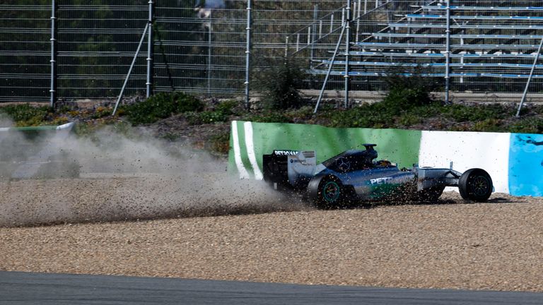 Lewis Hamilton heads for the barrier, minus a front wing