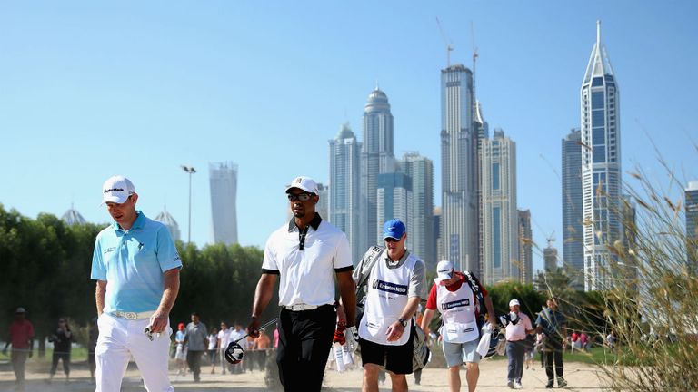 Stephen Gallacher (L) with Tiger Woods during the Champions Challenge in Dubai