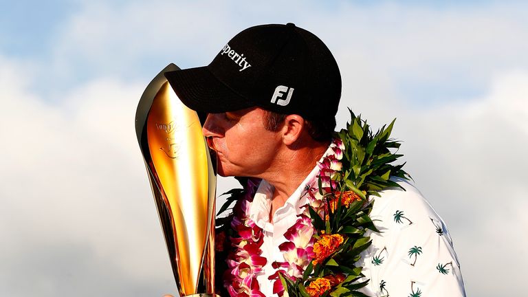 Jimmy Walker poses with the trophy after winning the Sony Open in Hawaii at Waialae Country Club