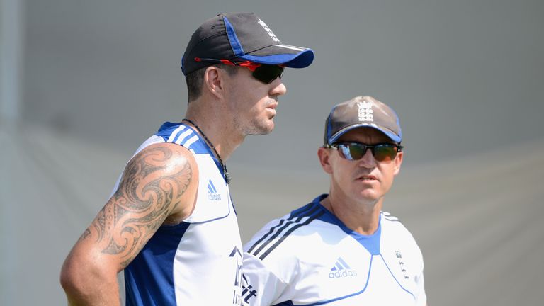 Kevin Pietersen of England speaks with coach Andy Flower during a nets session at Sardar Patel Stadium on November 13, 2012