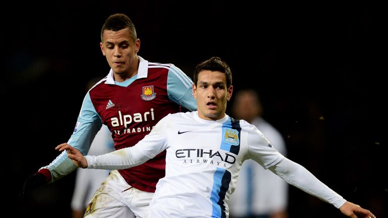 LONDON, ENGLAND - JANUARY 21:  Marcos Mesquita Lopes of Manchester City evades Ravel Morrison of West Ham United during the Capital One Cup Semi-Final, Sec