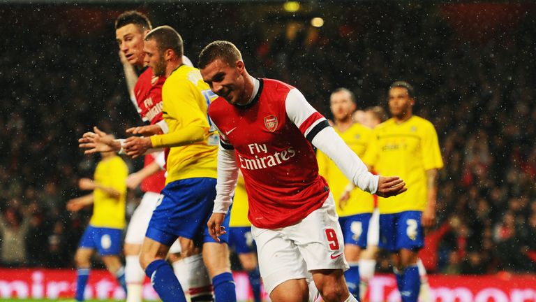Lukas Podolski of Arsenal celebrates scoring a goal against Coventry City in the FA Cup.