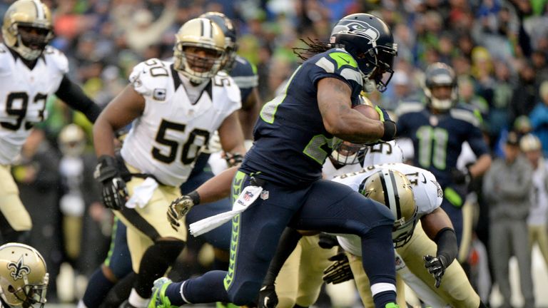 Marshawn Lynch of the Seattle Seahawks scores a touchdown against the New Orleans Saints