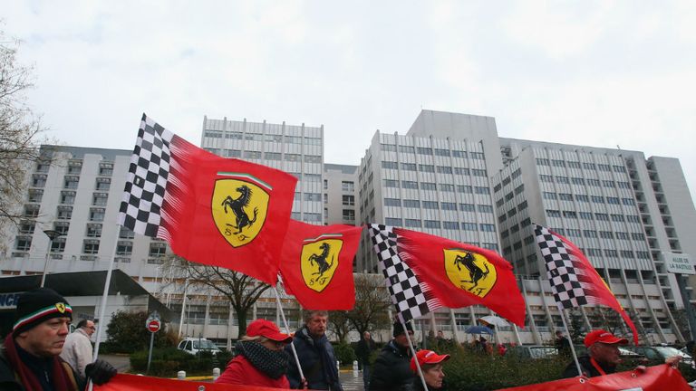 Ferrari fans gather outside the hospital
