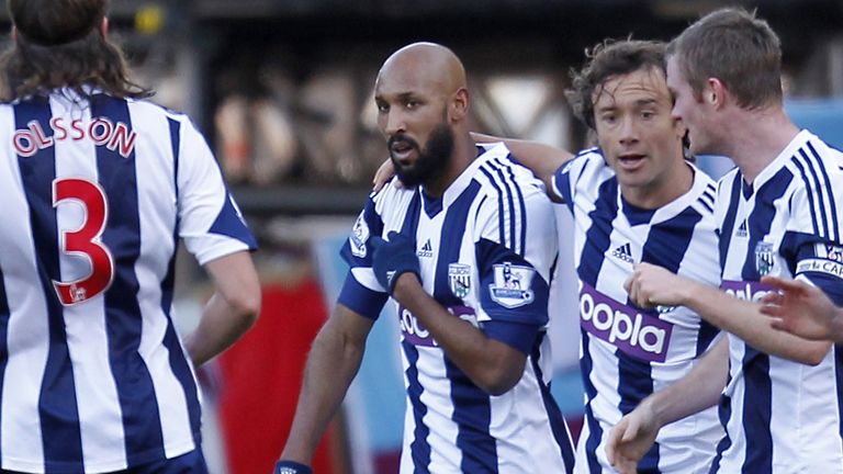 West Bromwich Albion's French striker Nicolas Anelka (C) gestures as he celebrates scoring their first goal during the English Premier League football matc