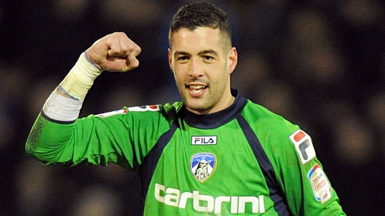Oldham Athletic goalkeeper Dean Bouzanis celebrates after the final whistle