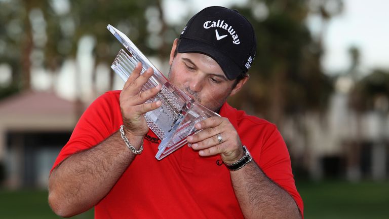 Patrick Reed kisses his trophy on the 18th green after winning the Humana Challenge in partnership with the Clinton Foundation 
