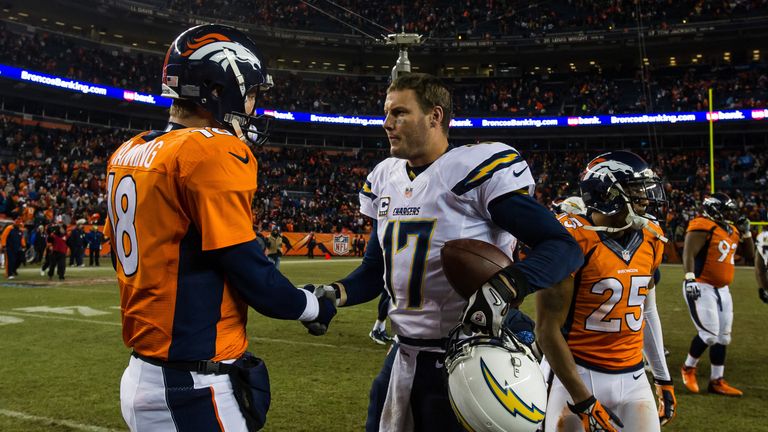 Quarterback Peyton Manning #18 of the Denver Broncos congratulates quarterback Philip Rivers #17 of the San Diego Chargers