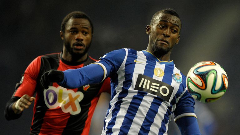 Porto's Colombian forward Jackson Martinez (R) vies with Olhanense's Senegalese defender Oumar Diakhite during the Portuguese league football match FC Port