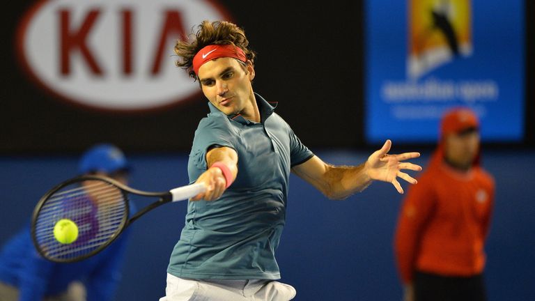 Switzerland's Roger Federer plays a shot against Spain's Rafael Nadal during their men's singles semi-final match on day 12 of the 2014 Australian Open