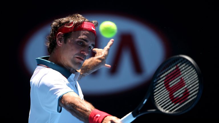 Roger Federer of Switzerland plays a backhand in his first round match against James Duckworth of Australia during the Australian Open