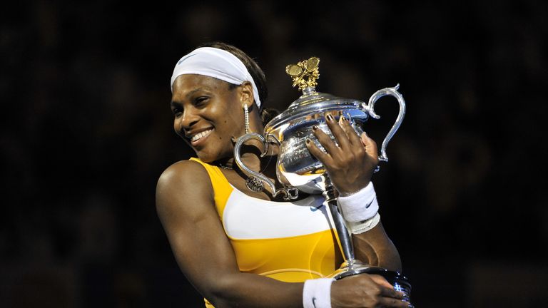 Serena Williams poses with the trophy after victory in the 2010 Australian Open