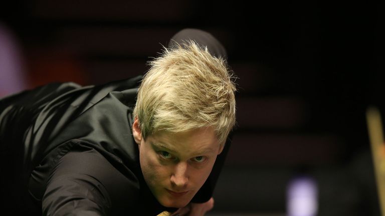 Neil Robertson (left) plays his shot watched by Mark Allen during the 2014 Dafabet Masters at Alexandra Palace, London.