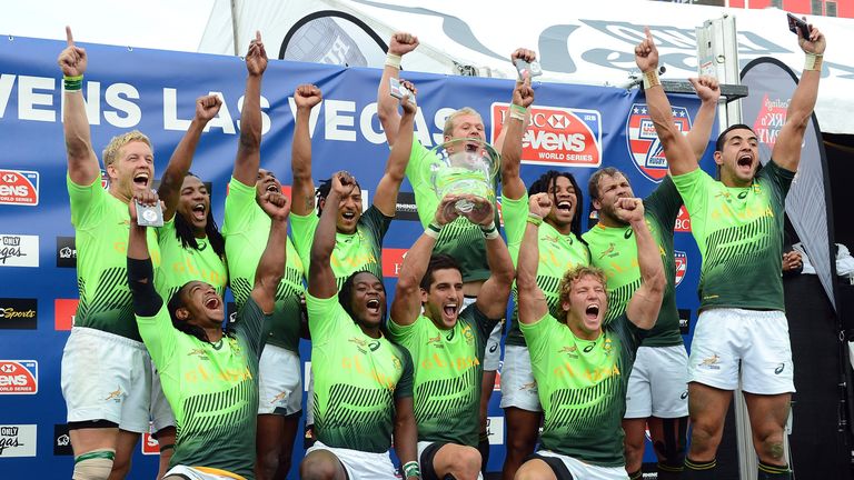 Members of the South Africa team celebrate after winning the Cup Final match 14-7 over New Zealand during the Las Vegas Sevens 