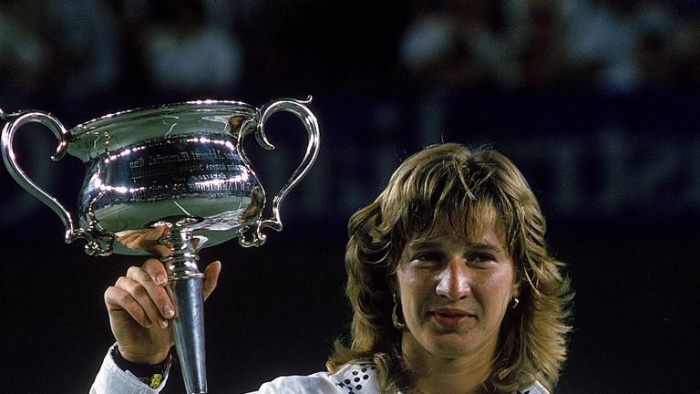 Steffi Graf of Germany raises the trophy after winning the 1988 Australian Open