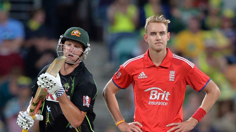 England paceman Stuart Broad (R) reacts on a miss field as Australian batsman Cameron White (L) runs during the first cricket T20 international match in Ho