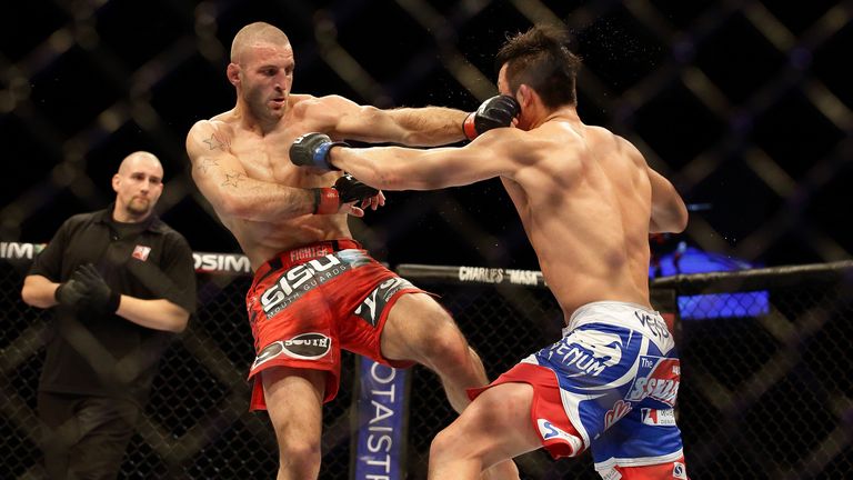 Tarec Saffiedine (L) fights Lim Hyun Gyu during UFC Fight Night in Singapore