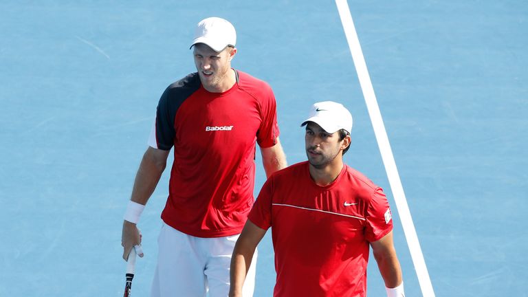 Treat Huey of the Philippines and Dominic Inglot of Great Britain in action in their fourth round doubles match at the Australian Open