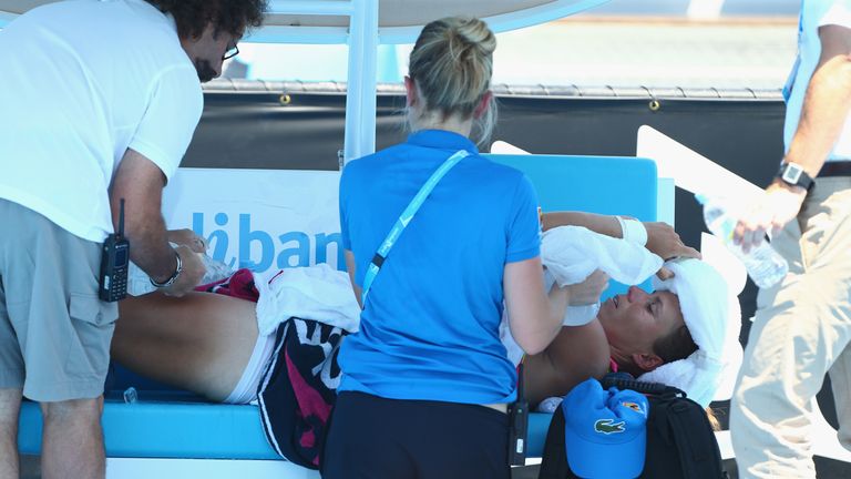 Varvara Lepchenko of the USA is treated by medical staff during day four of the 2014 Australian Open at Melbourne Park 