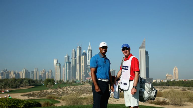 Tiger Woods poses with caddie Joe LaCava at the Emirates GC in Dubai