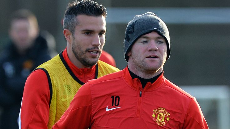 Manchester United's Wayne Rooney and Robin van Persie take part in a training session