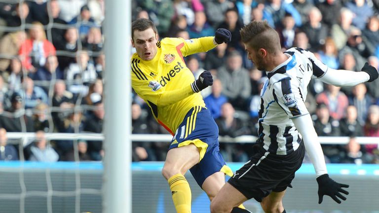 - Adam Johnson of Sunderland shoots on goal past Davide Santon of Newcastle during the Premier League match between Newcastle United and Sunderland