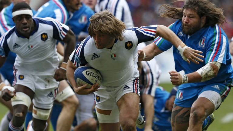 - Frances hooker Dimitri Szarzewski C evades Italys prop Martin Castrogiovanni R during the Six Nations international rugby union match France vs Italy