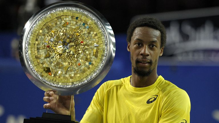 - French tennis player Gael Monfils poses with his trophy after winning over Frances Richard Gasquet in the final tennis match of the Open Sud de France