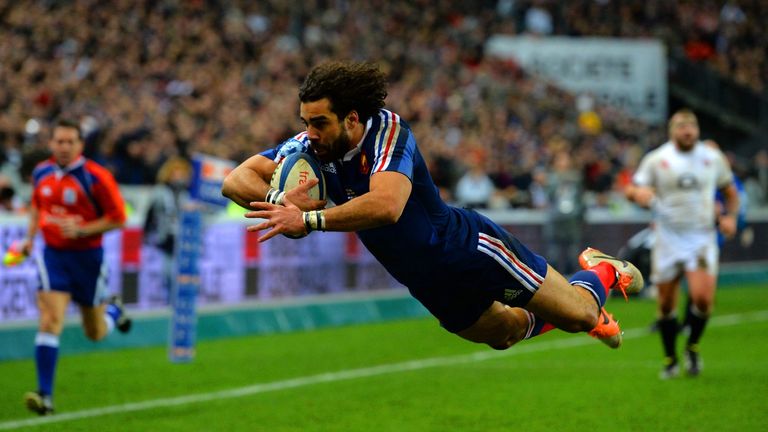Yoann Huget of France dives in to score his second try
