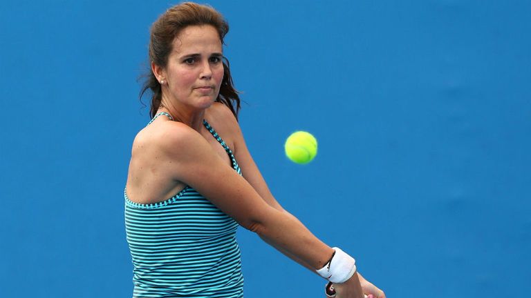 - Mary Joe Fernandez of the United States plays a backhand in her Womens Legends Doubles match with Tracy Austin