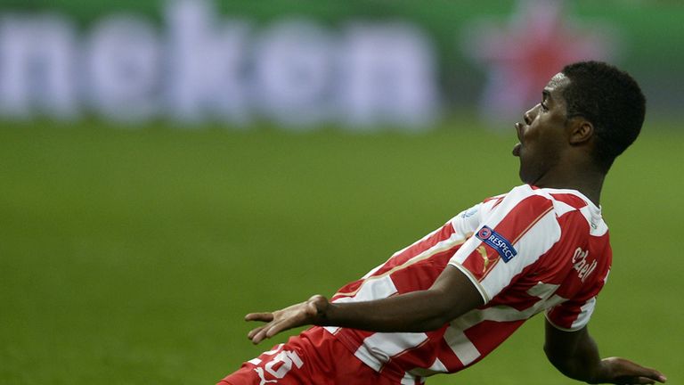 Joel Campbell: Olympiakos' on-loan Arsenal man celebrates his strike against Manchester United