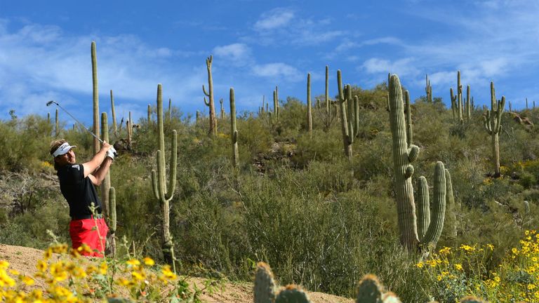 - Victor Dubuisson of France plays a shot on the 12th hole during the semi-final round of the World Golf Championships - Accenture Match Play Championship