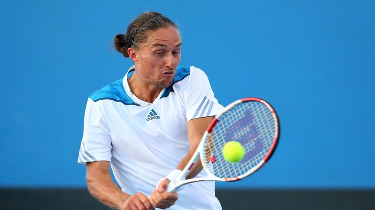 Alexandr Dolgopolov plays a backhand in his first-round match against Ricardas Berankis at Australian Open. 