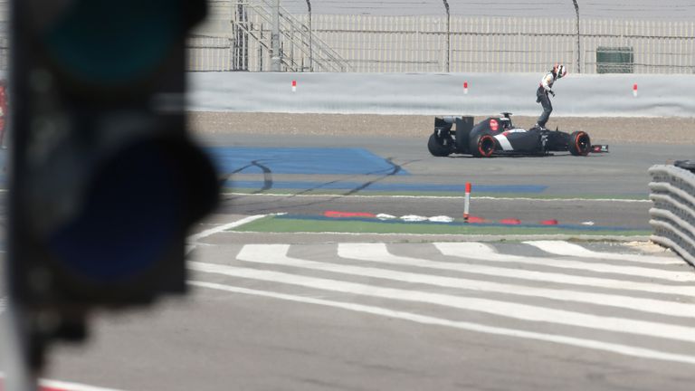 Adrian Sutil leaps out of the Sauber