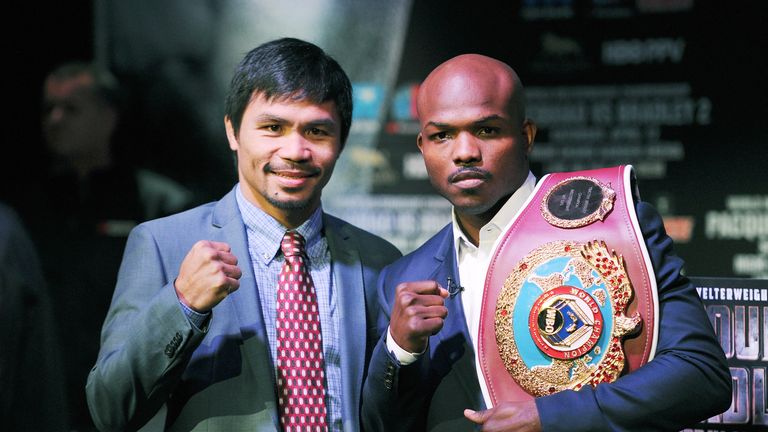Manny Pacquiao, left, and Timothy Bradley stand for photos during a press conference. Feb 6 2014.