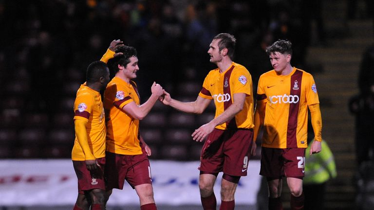 Bradford City's Carl McHugh (second from the left) is congratulated by James Hanson after scoring the only goal of the game during the Sky Bet League One m