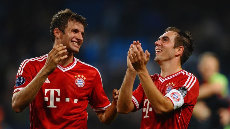 MANCHESTER, ENGLAND - OCTOBER 02: Thomas Muller and Philipp Lahm of FC Bayern Muenchen celebrates during the UEFA Champions League Group D match between Ma