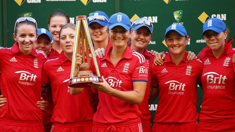 England captain Charlotte Edwards poses with the team and the trophy after their 10-8 victory in the multi-format Ashes series in Australia