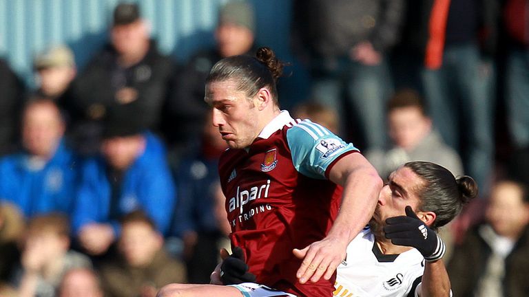 Swansea City's Chico Flores (right)with West Ham United's Andy Carroll during the Barclays Premier League match at Upton Park, London.