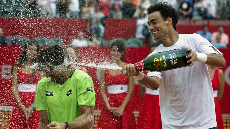 Fabio Fognini (right) sprays Copa Claro winner David Ferrer with champagne. Buenos Aires, Feb 16 2014.