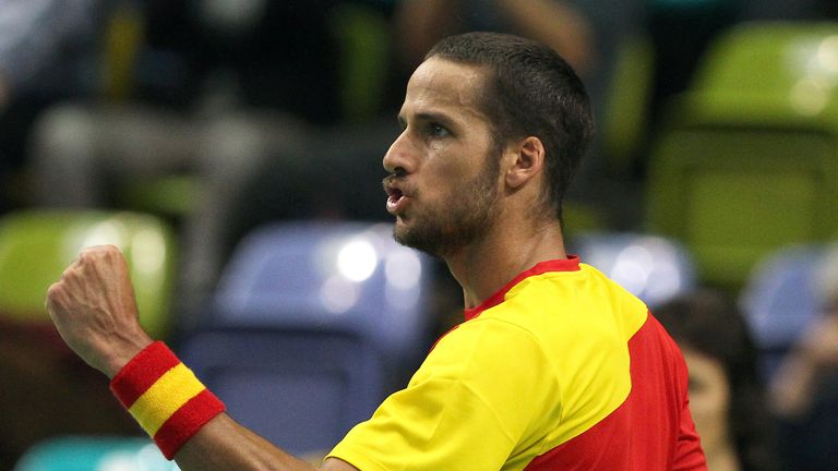 Feliciano Lopez of Spain reacts as he plays against Germany's Florian Mayer during the Davis Cup match in Frankfurt/Main