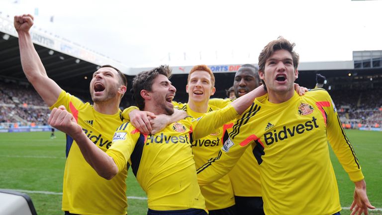 Fabio Borini (2nd L) of Sunderland celebrates after scoring the opening goal at Newcastle