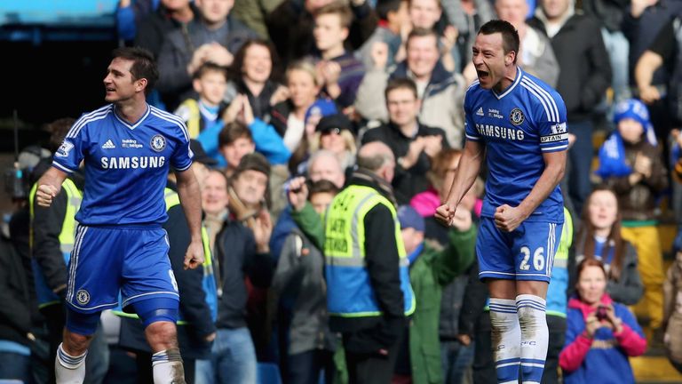 Frank Lampard of Chelsea (l) celebrates with John Terry after his free-kick hits Tim Howard and goes in