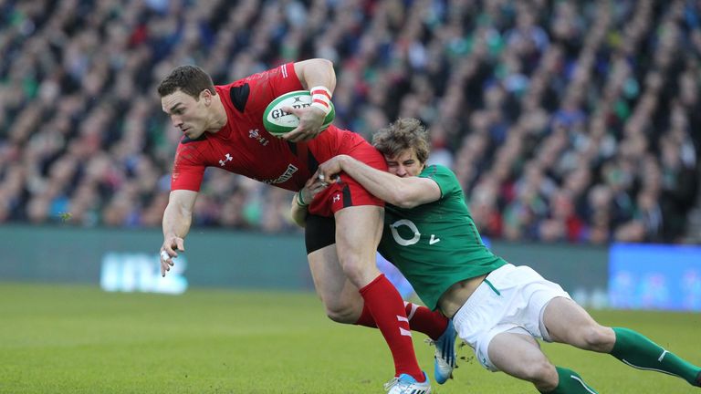 Wales wing George North is tackled by Ireland wing Andrew Trimble during the Six Nations clash in Dublin