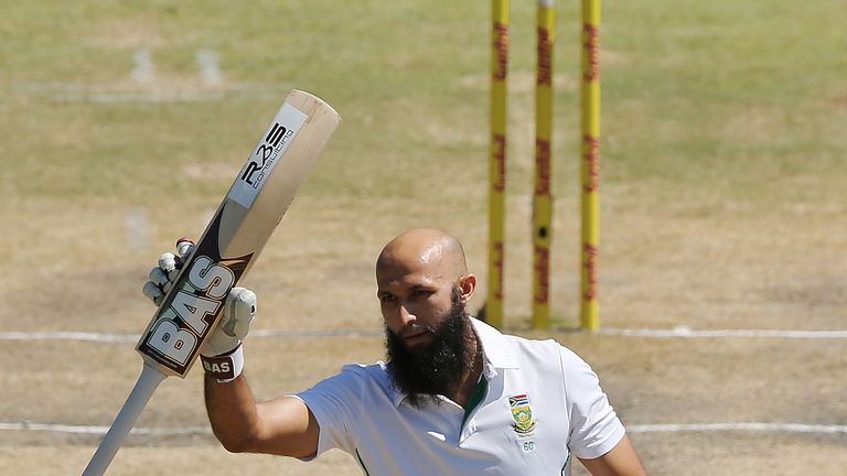 Hashim Amla of South Africa celebrates getting 100 runs during day four of the Second Test against Australia